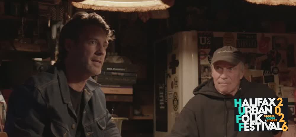 Steve Lund and Mike Campbell in Mike's backyard Tiki bar, with the HUFF logo.
